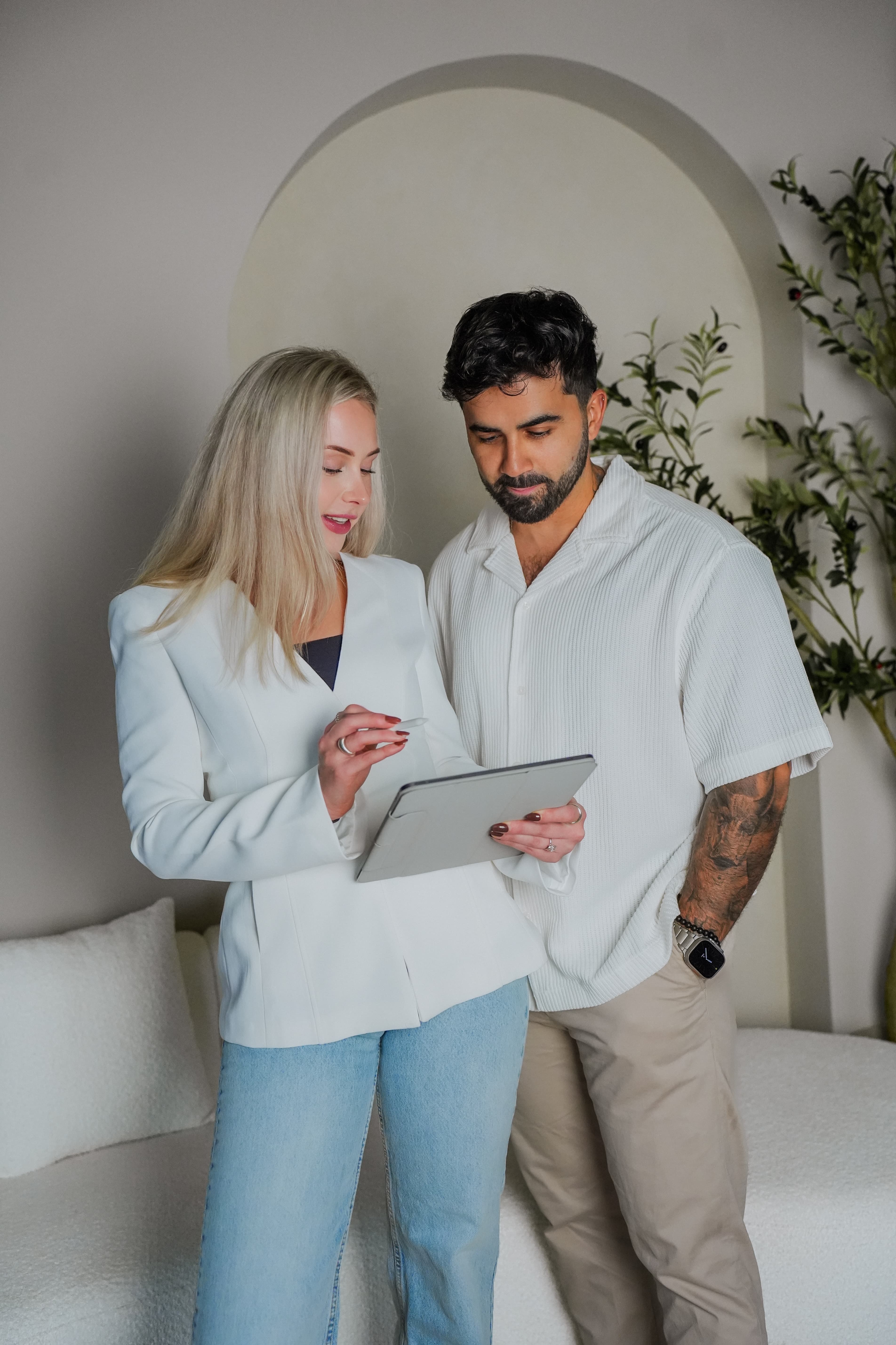 Ash and Mila reviewing market data
